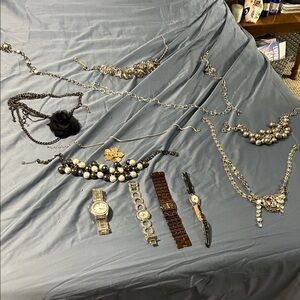 Elegant Silver and Black Women's Jewelry Set with watches and belt.